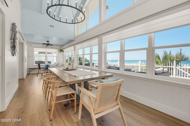 13011 Oleander, Panama City Beach, FL 32407 - sunroom featuring a water view, visible vents, a chandelier, and a beach view
