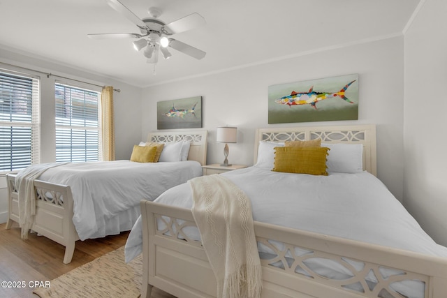 13011 Oleander, Panama City Beach, FL 32407 - bedroom featuring ceiling fan, wood finished floors, and crown molding