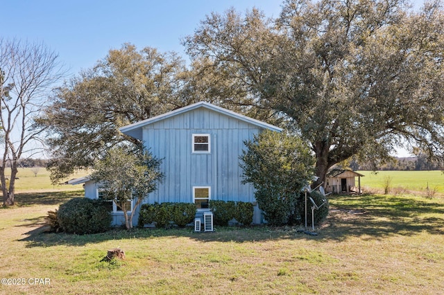 view of home's exterior featuring a lawn