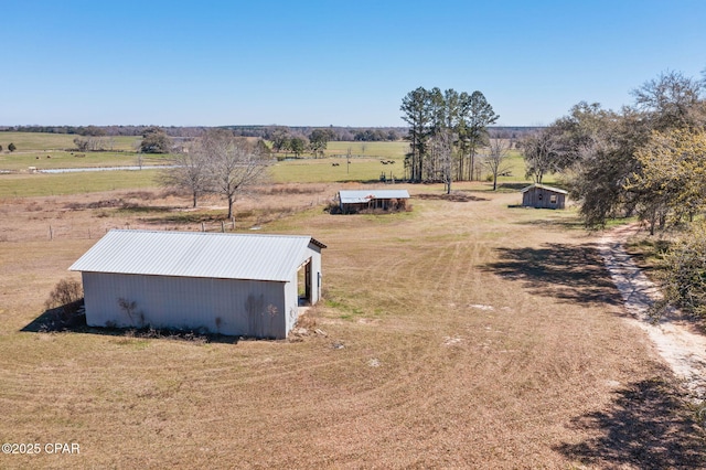 birds eye view of property featuring a rural view