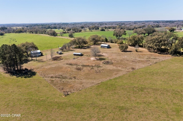 birds eye view of property featuring a rural view