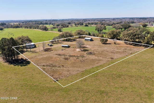 birds eye view of property featuring a rural view