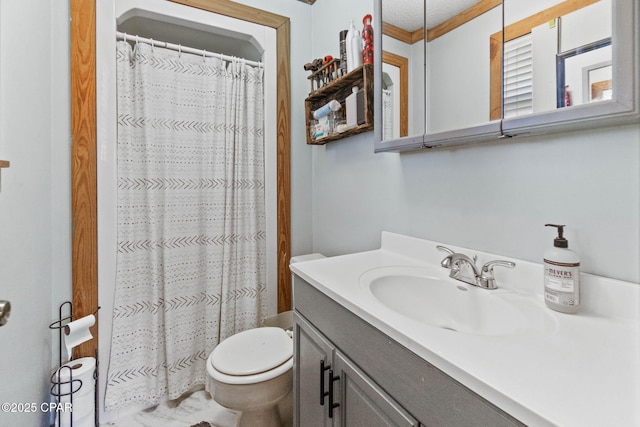 bathroom featuring curtained shower, toilet, ornamental molding, and vanity