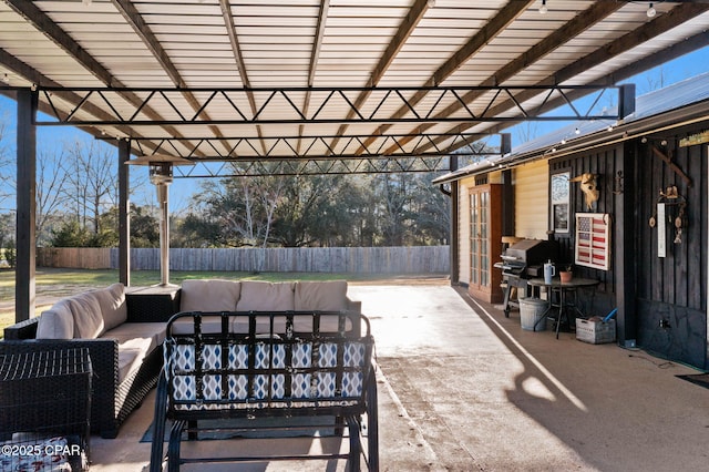 view of patio featuring grilling area, outdoor lounge area, and fence