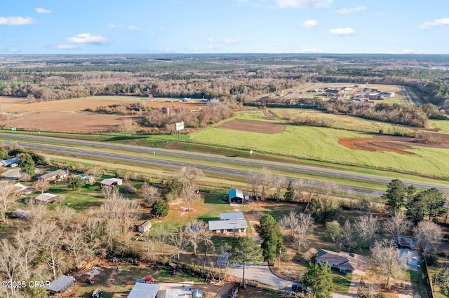 birds eye view of property with a rural view