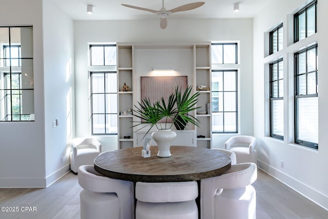 dining area featuring a healthy amount of sunlight and baseboards