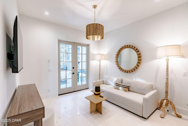 living area with recessed lighting, baseboards, and french doors