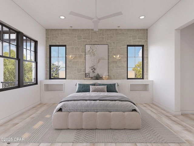 bedroom featuring baseboards, multiple windows, wood finished floors, and recessed lighting