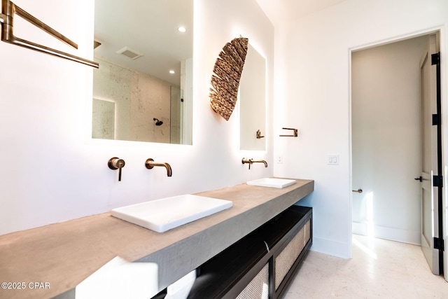 bathroom with a walk in shower, recessed lighting, a sink, visible vents, and double vanity