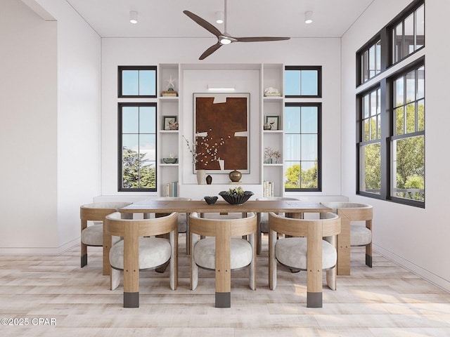 dining room with baseboards and a ceiling fan