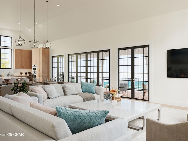 living room featuring wood finished floors, recessed lighting, french doors, a high ceiling, and baseboards