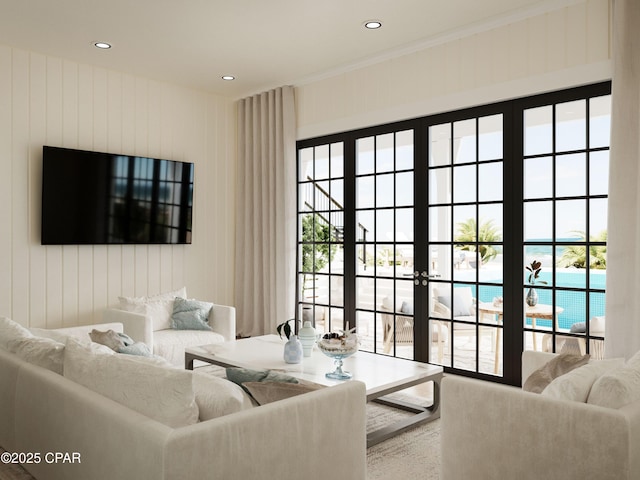 living room with recessed lighting, a healthy amount of sunlight, and french doors