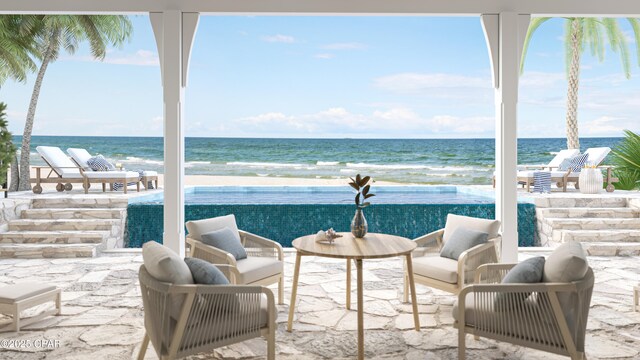 view of patio / terrace with outdoor lounge area and a water view