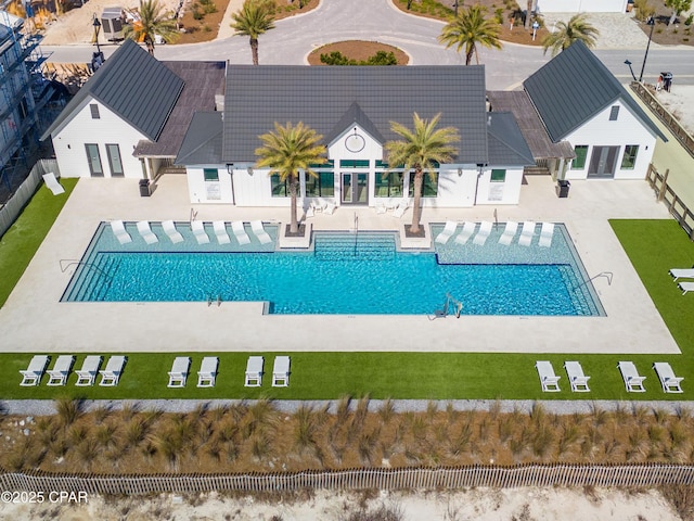 view of swimming pool with a patio area, central air condition unit, and fence