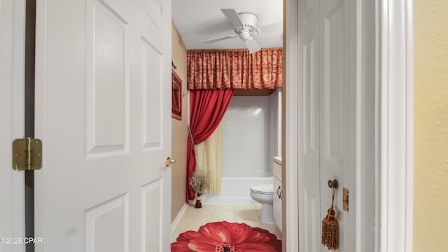 bathroom with tile patterned floors, shower / bathtub combination with curtain, toilet, and ceiling fan