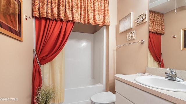 bathroom featuring toilet, shower / bath combo, and vanity