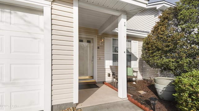 doorway to property featuring a garage