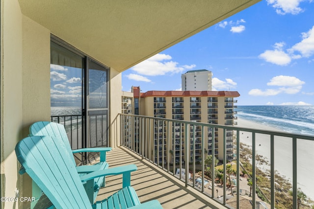 balcony featuring a beach view