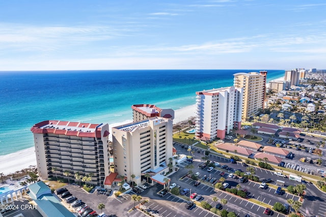 aerial view featuring a view of the beach, a view of city, and a water view