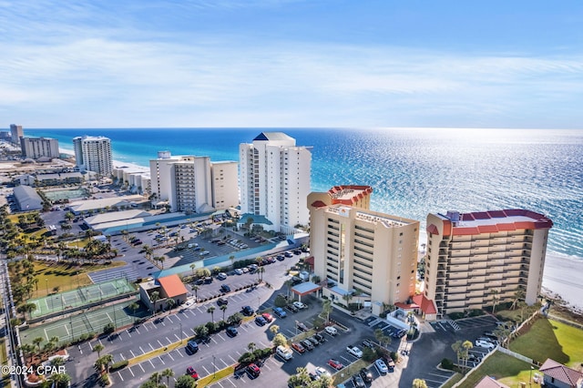 birds eye view of property with a view of city and a water view