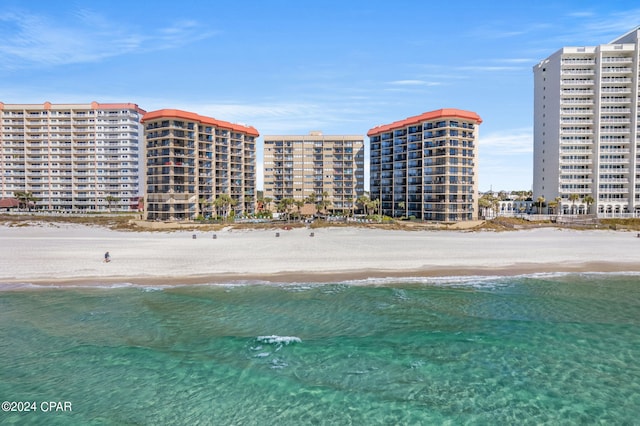 aerial view with a view of city, a view of the beach, and a water view