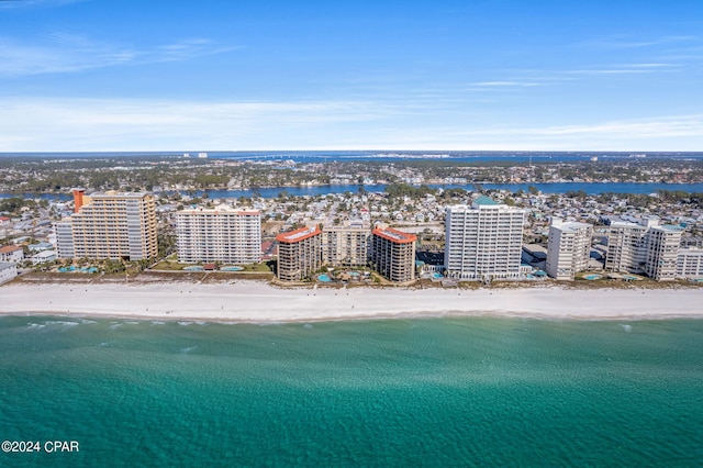 bird's eye view featuring a water view, a city view, and a view of the beach