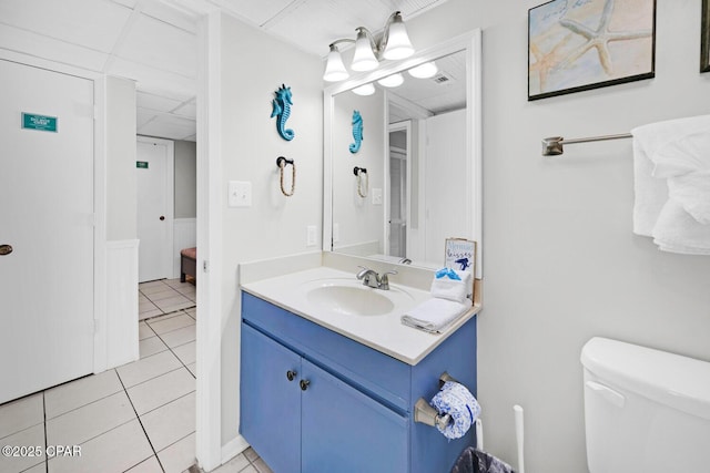 520 Richard Jackson Blvd Unit 3308, Panama City Beach, FL 32407 - bathroom with tile patterned floors, toilet, vanity, and a paneled ceiling