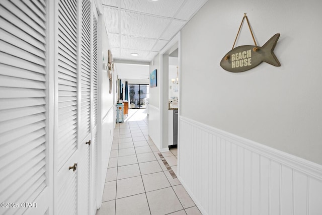 520 Richard Jackson Blvd Unit 3308, Panama City Beach, FL 32407 - corridor featuring light tile patterned floors and wainscoting