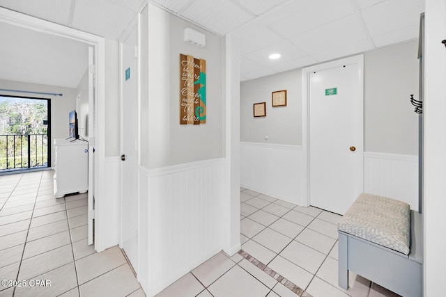520 Richard Jackson Blvd Unit 3308, Panama City Beach, FL 32407 - hallway with a drop ceiling, a wainscoted wall, and light tile patterned flooring