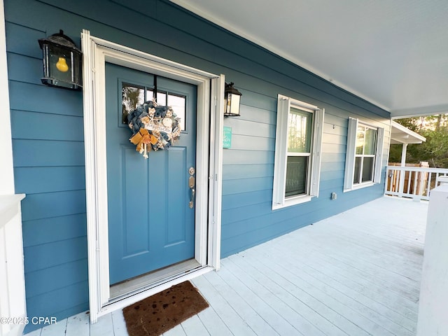 entrance to property with a porch