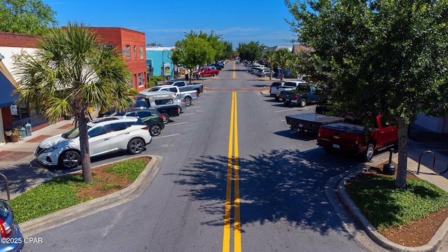 view of street featuring curbs and sidewalks