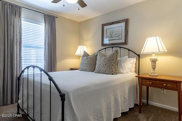 bedroom with carpet floors, ceiling fan, and baseboards