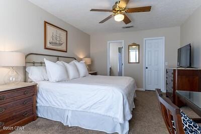 carpeted bedroom with a ceiling fan