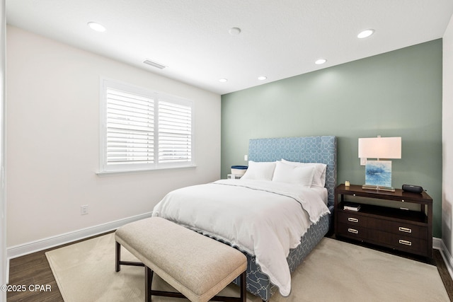 bedroom featuring recessed lighting, baseboards, and wood finished floors
