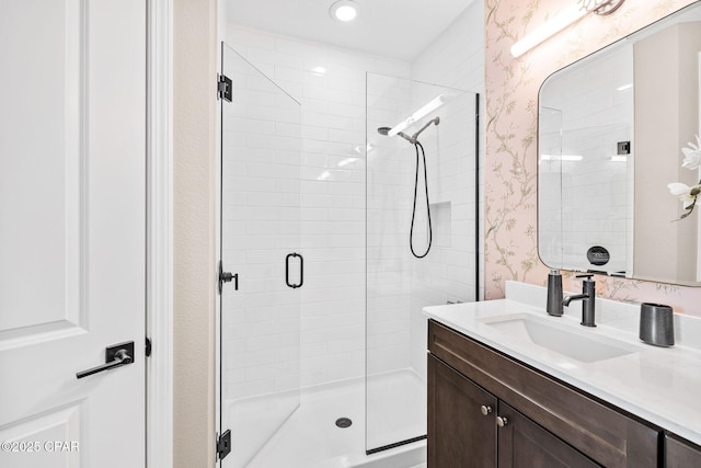 8634 Shell Sink Dr, Panama City Beach, FL 32413 - full bath with a stall shower, vanity, wallpapered walls, and recessed lighting