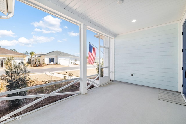 unfurnished sunroom with a residential view