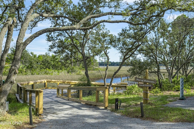 view of community with a water view