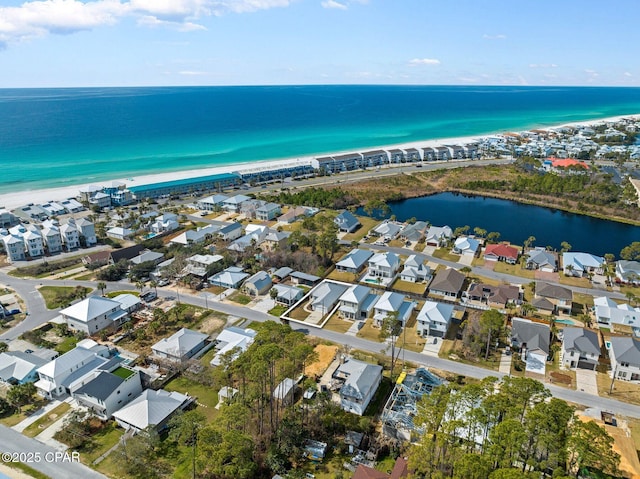 drone / aerial view with a water view and a residential view