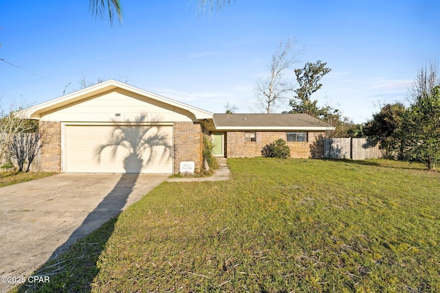 view of front of house featuring brick siding, an attached garage, fence, a front yard, and driveway