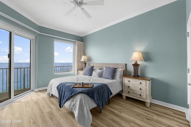 bedroom with ceiling fan, crown molding, baseboards, and wood finished floors