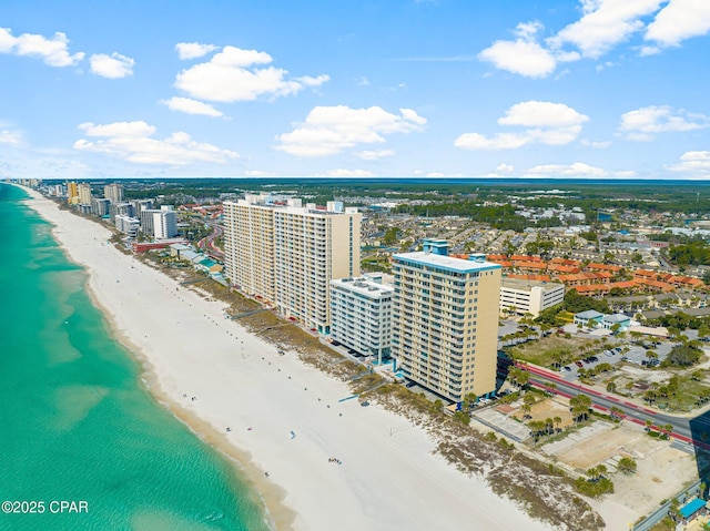 birds eye view of property with a view of the beach, a water view, and a view of city