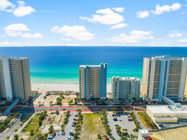 birds eye view of property with a view of city and a water view