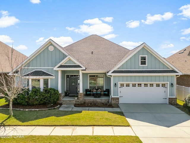 craftsman inspired home with board and batten siding, a shingled roof, a garage, and concrete driveway