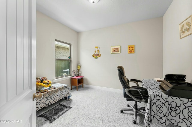 carpeted home office featuring baseboards