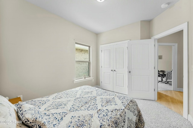 bedroom featuring a closet and wood finished floors