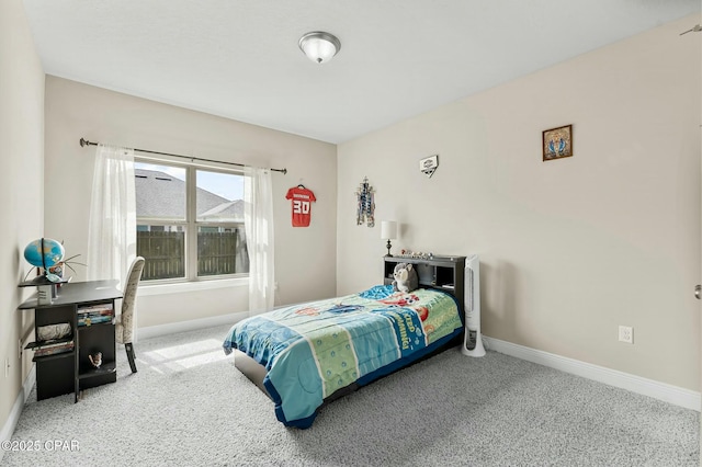 bedroom featuring carpet floors and baseboards