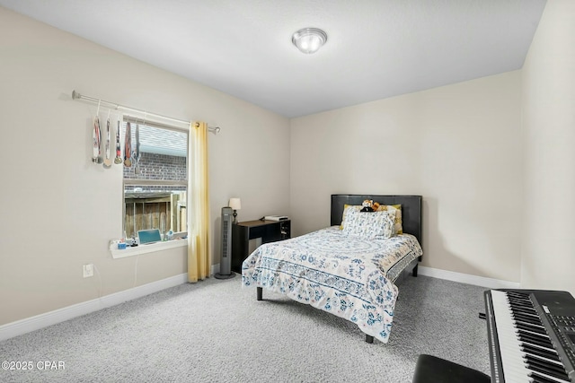 bedroom featuring carpet flooring and baseboards