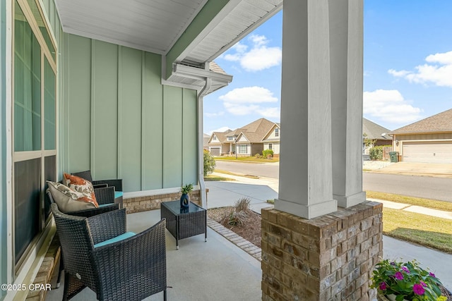 view of patio / terrace featuring covered porch and a residential view