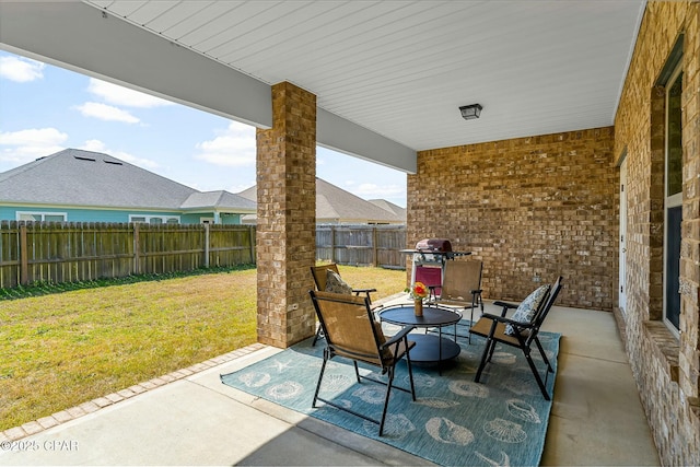 view of patio / terrace with a fenced backyard and a grill