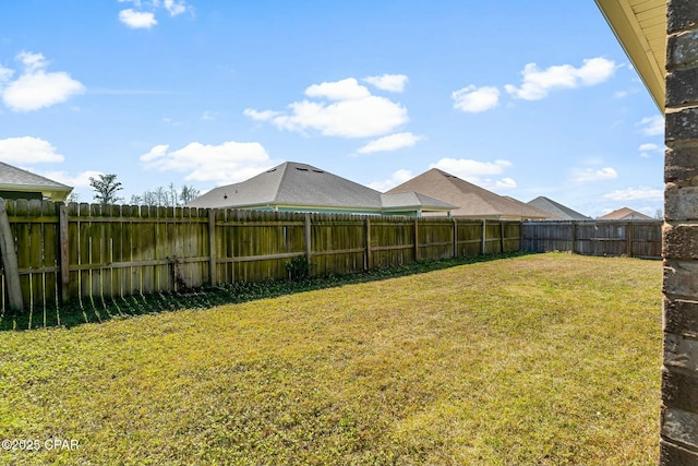 view of yard featuring a fenced backyard